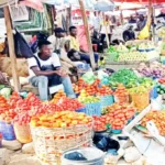 Nigeria's Inflation Drops to 14.45% in November, Achieving Tinubu's Target Amid Rebasing Controversy and Persistent Cost-of-Living Pressures